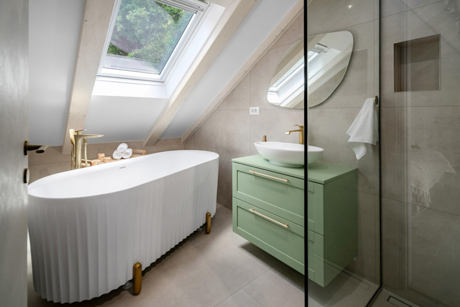 The 18 sqm master bedroom includes a stunning freestanding bathtub.