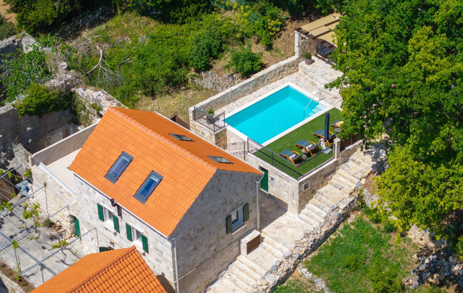 The villa is surrounded by vibrant Mediterranean vegetation, ensuring a serene and peaceful escape.
