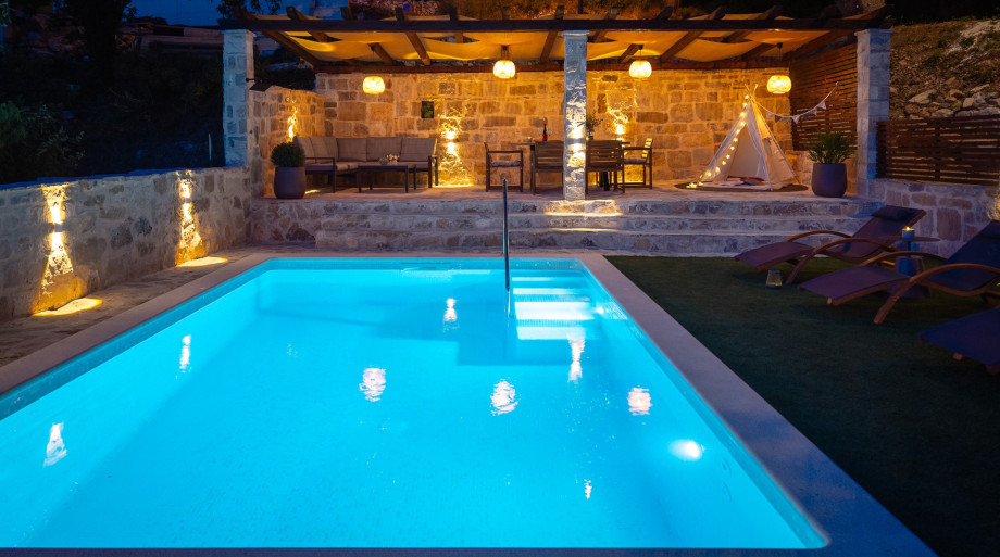 Gather for relaxing dinner in the covered dining area.