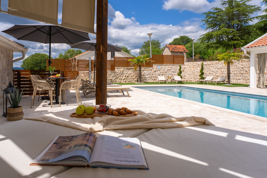 Enjoy the  lounge corner located right next to the heated pool.