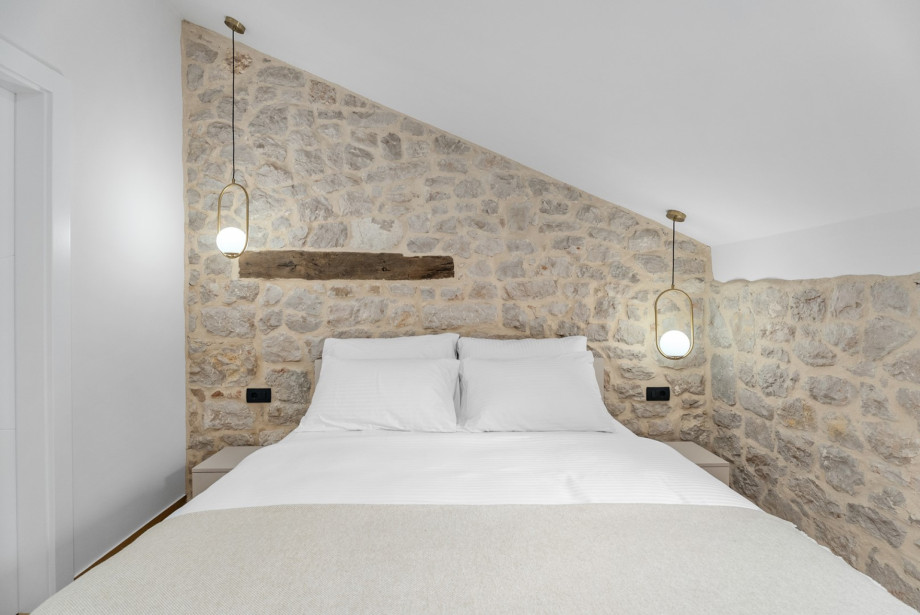 Relax in Bedroom 1, featuring a 160cm x 200cm bed and an en-suite bathroom for total privacy.