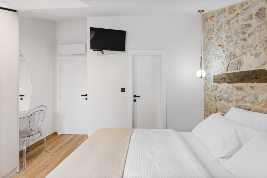 Air-conditioned bedroom with double bed and television available.
