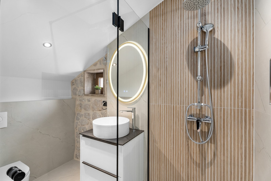 Relax in the en-suite bathroom, designed for privacy and maximum comfort.