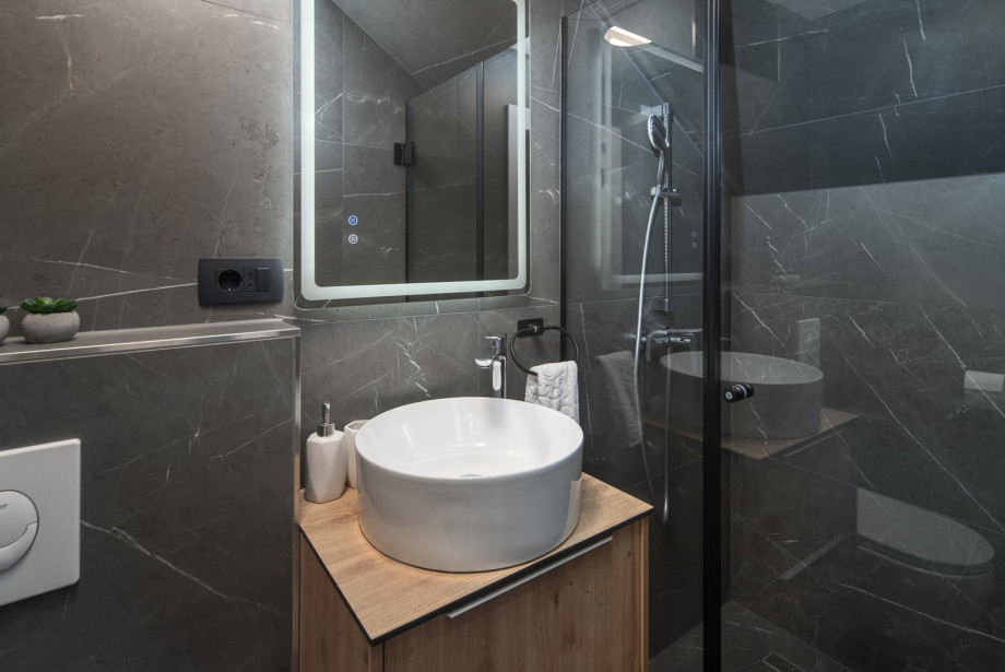 On the ground floor there is a beautifully decorated and practical separate guest bathroom.