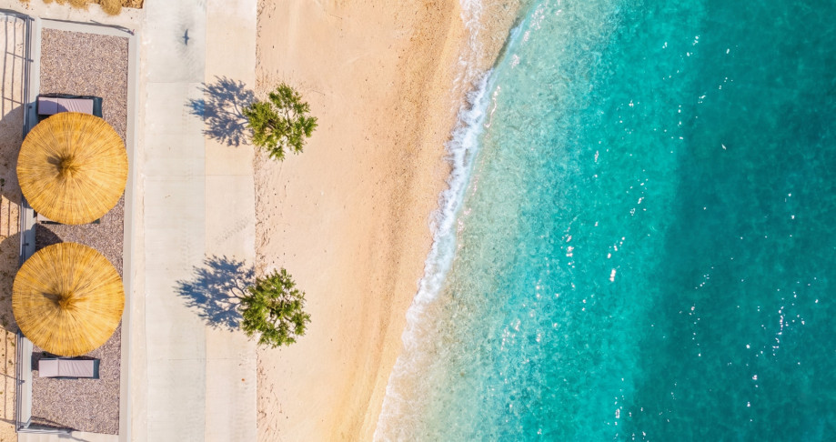 Private beach area, the perfect place to unwind just steps from the crystal-clear sea.