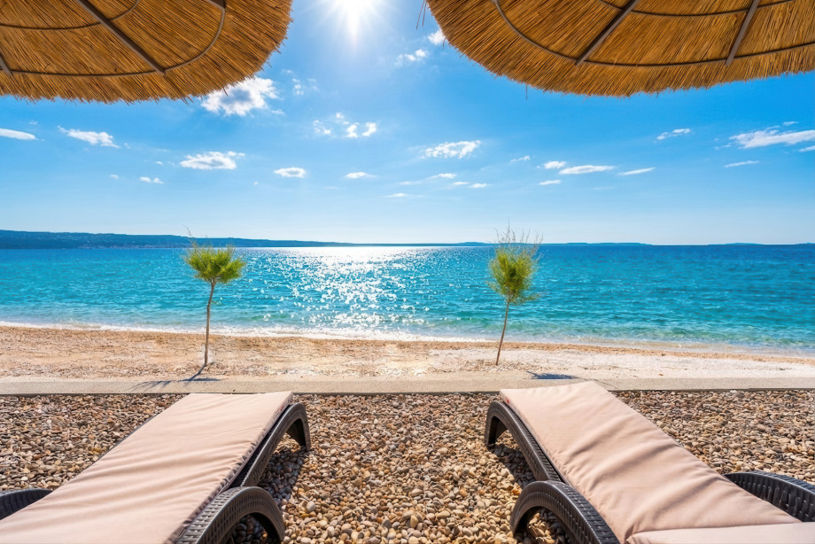 Private beach area, the perfect place to unwind just steps from the crystal-clear sea