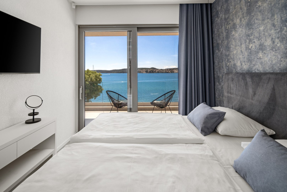 Bedroom 2, shared balcony with bedroom 1, with bathroom next door