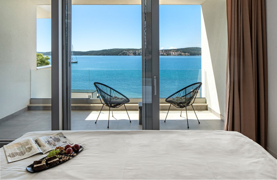 Modern seaside room with a stunning and private balcony, perfect for a relaxing getaway.