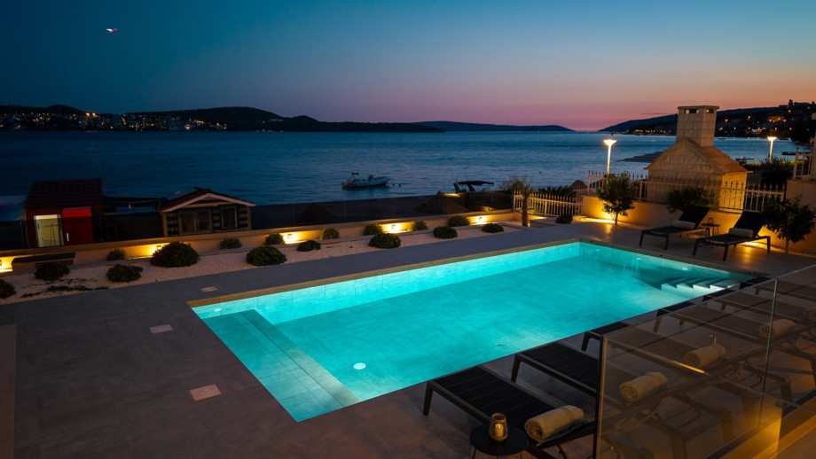 An enchanting, peaceful oasis on the beach by night.