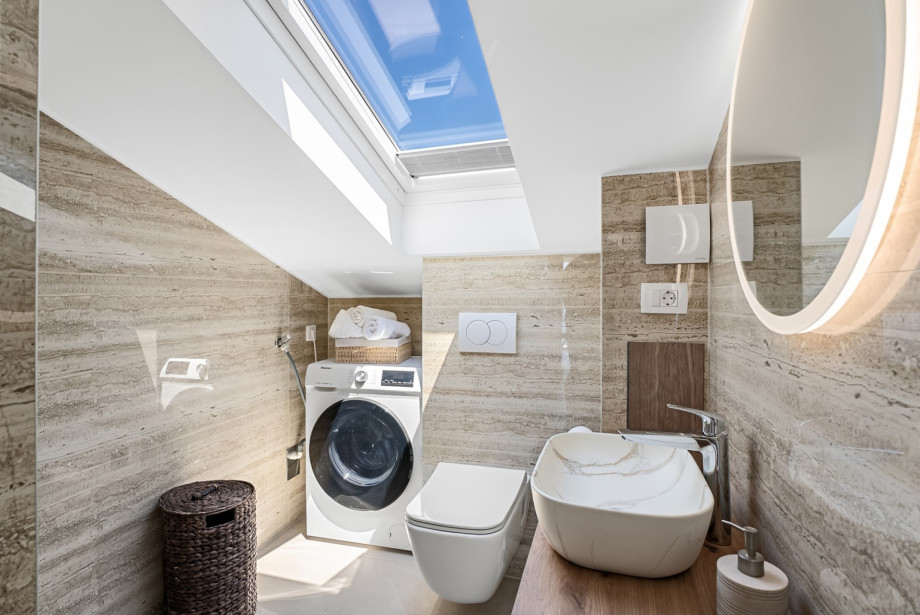 Family bathroom with washing machine