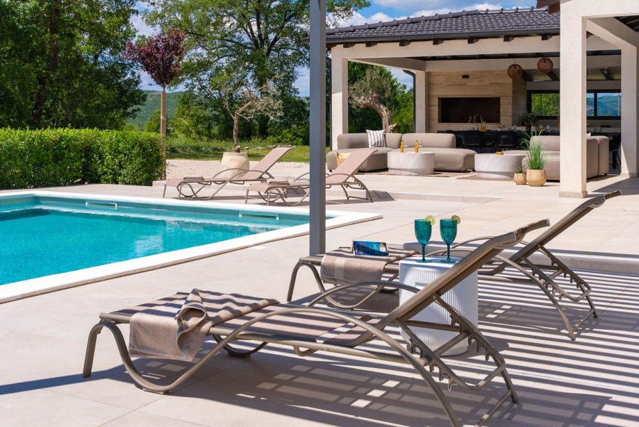 Spacious sun deck with loungers, ideal for enjoying
