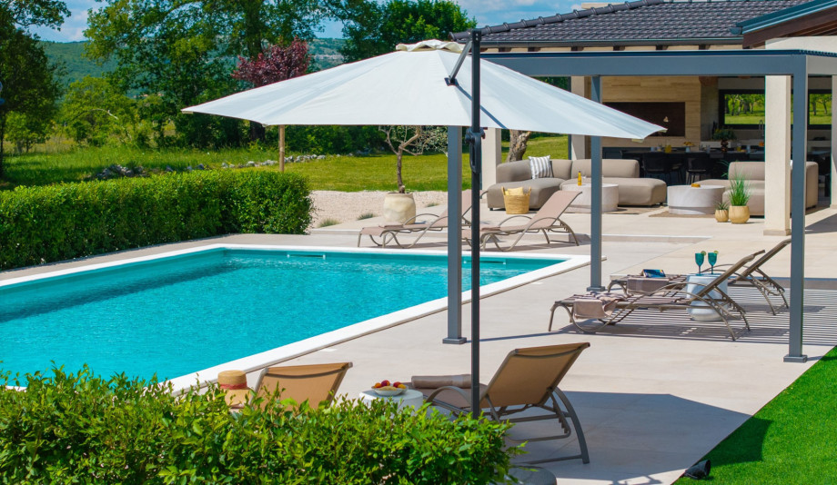 A sun deck with comfortable loungers and umbrellas for shade and rest