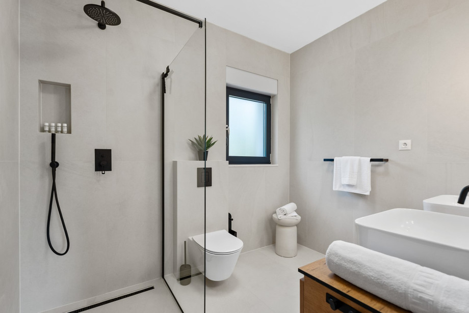 Family bathroom with shower and dual sinks