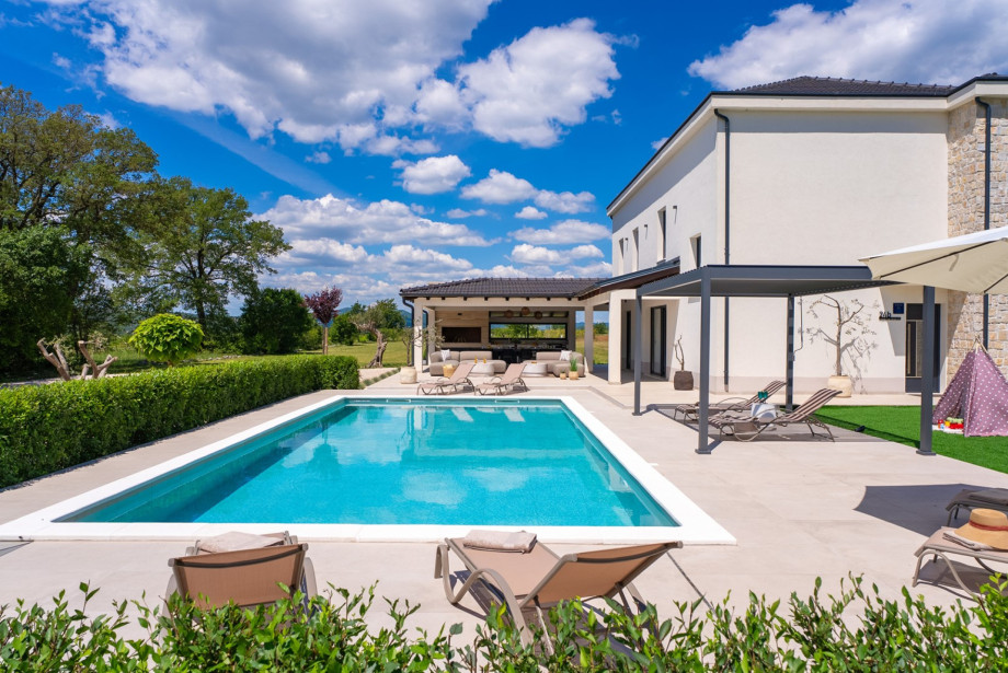 Step outside to discover your very own private retreat: a heated swimming pool
