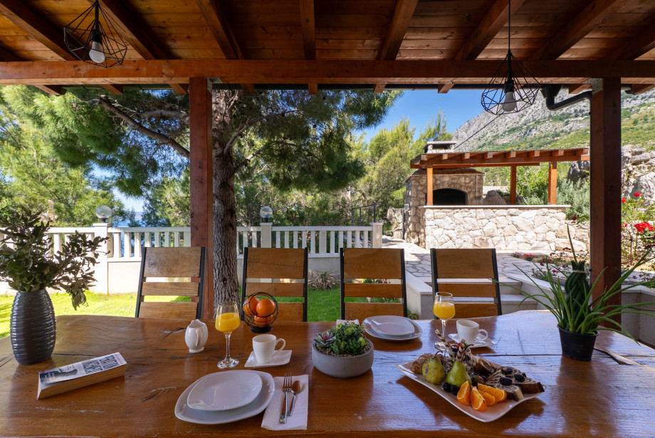 Outdoor dining area located next to the grill