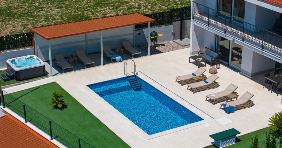 This exquisite three-story property spans 310 square meters