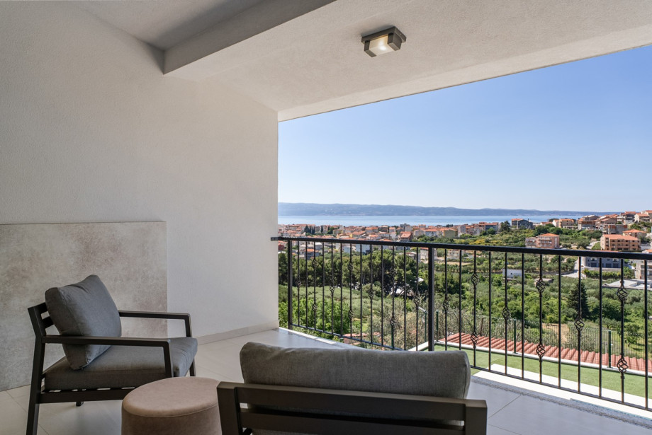 Step out onto the terrace to enjoy panoramic views of the village and sea