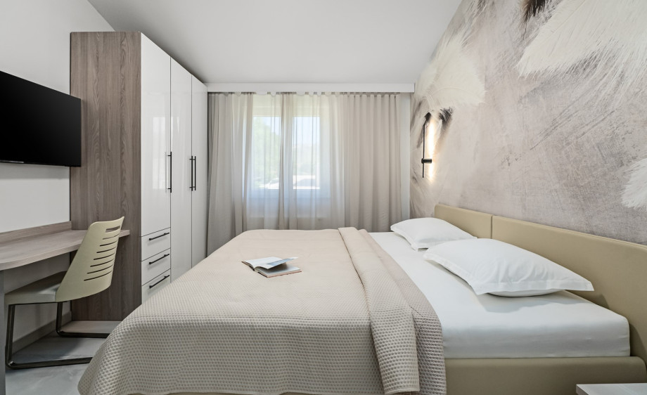 Bedroom No. 2, at 12.5 sqm, includes a super king-size bed (which can be separated into two singles)