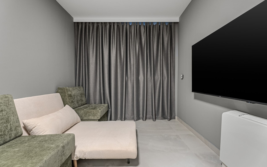 The ground floor also houses a 12 sqm playroom, perfect for entertainment, and a separate toilet for added convenience