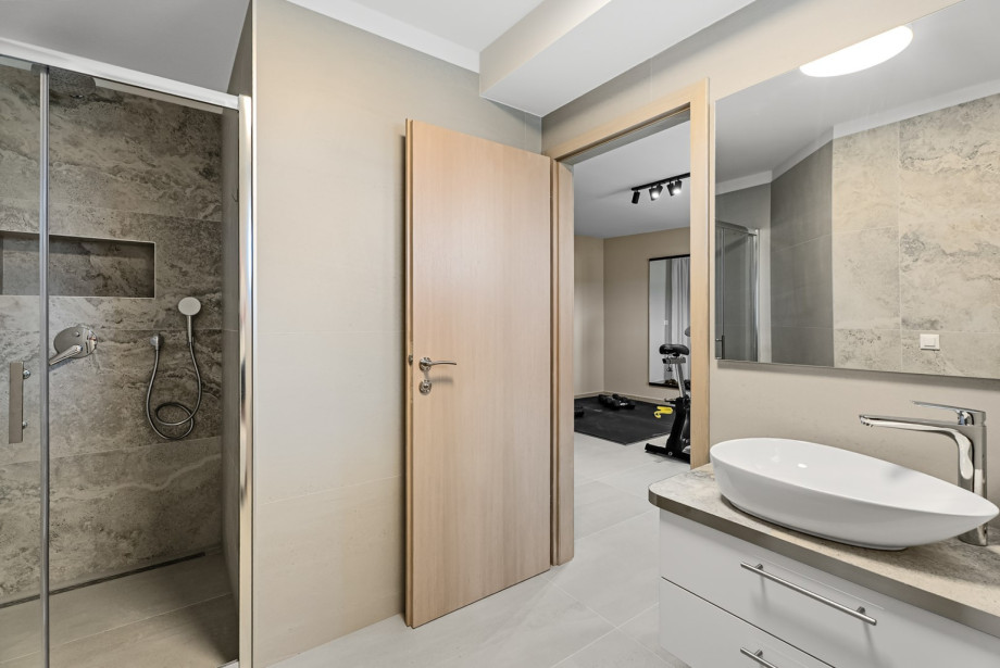 Also, there is a bathroom with a shower next to it