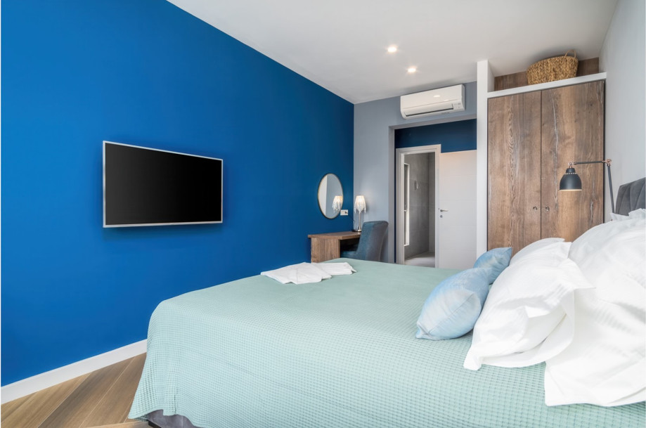 Bedroom No3 with a king-size bed 180x200cm, TV, A/C, en-suite bathroom with a shower, and a balcony