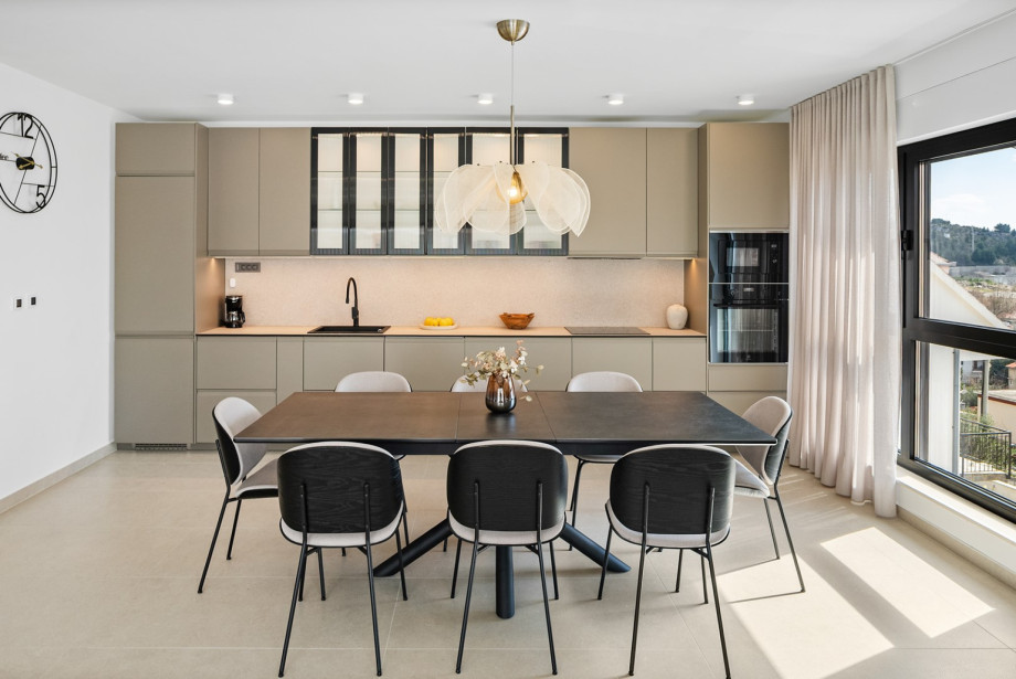 The fully equipped kitchen features a modern design.