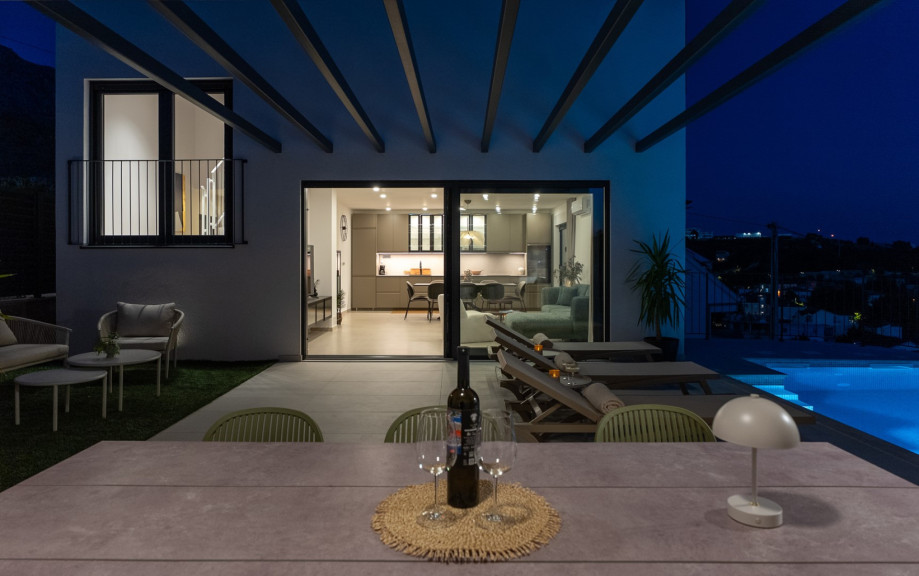 The outdoor area offers direct access to the kitchen and living room for a seamless flow.