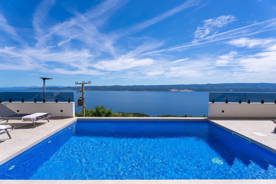 Stunning views of the sea, islands, and mountains, complemented by a beautifully designed outdoor area