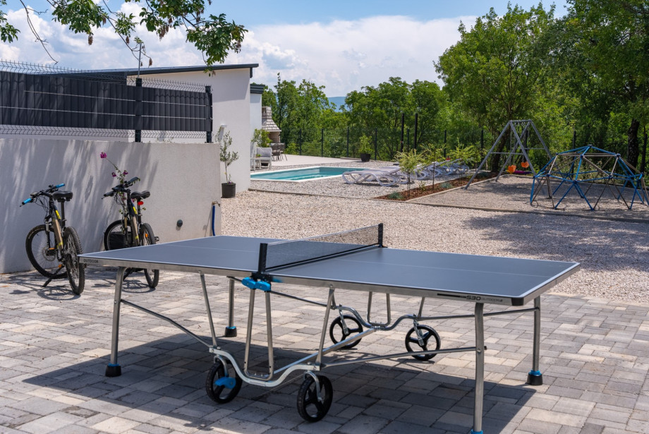 For family fun, an outdoor table tennis setup guarantees hours of entertainment.