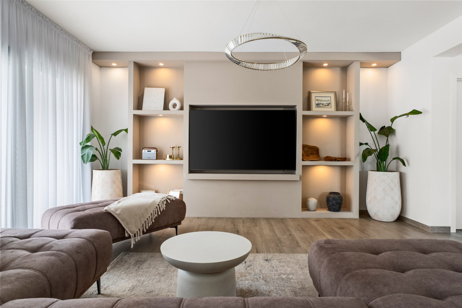 Designed for comfort and relaxation, the living room offers cozy seating, elegant décor, and direct views of the surrounding natural landscape.