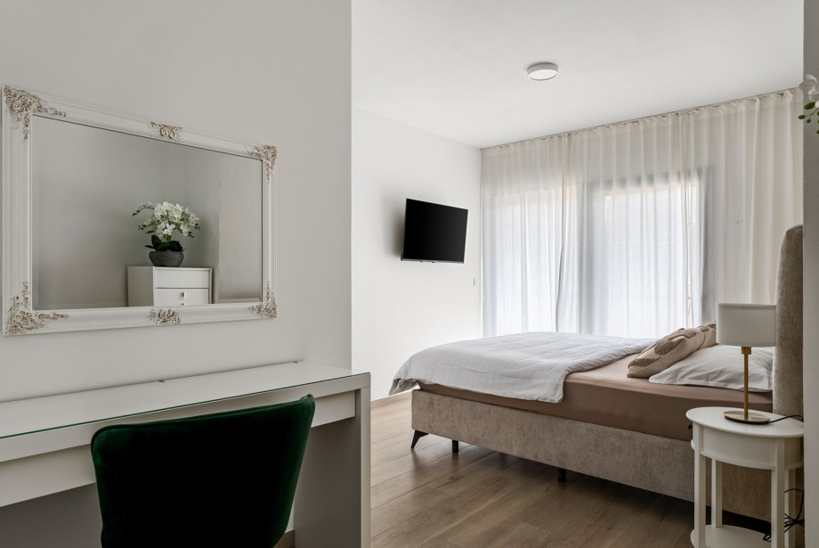 The first floor comprises three beautifully appointed bedrooms and two bathrooms