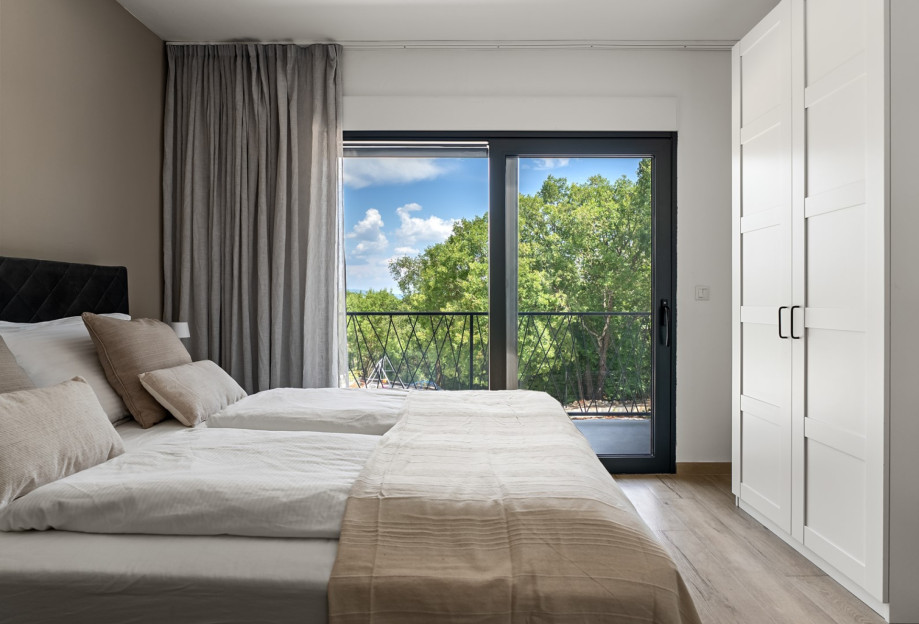 Bedroom 2 boasts lovely views of the surrounding natural landscape.