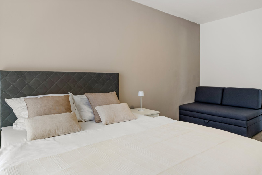 Bedroom 3 features a comfortable queen-size bed and a sofa bed that converts into a 140 x 190 cm sleeping area.