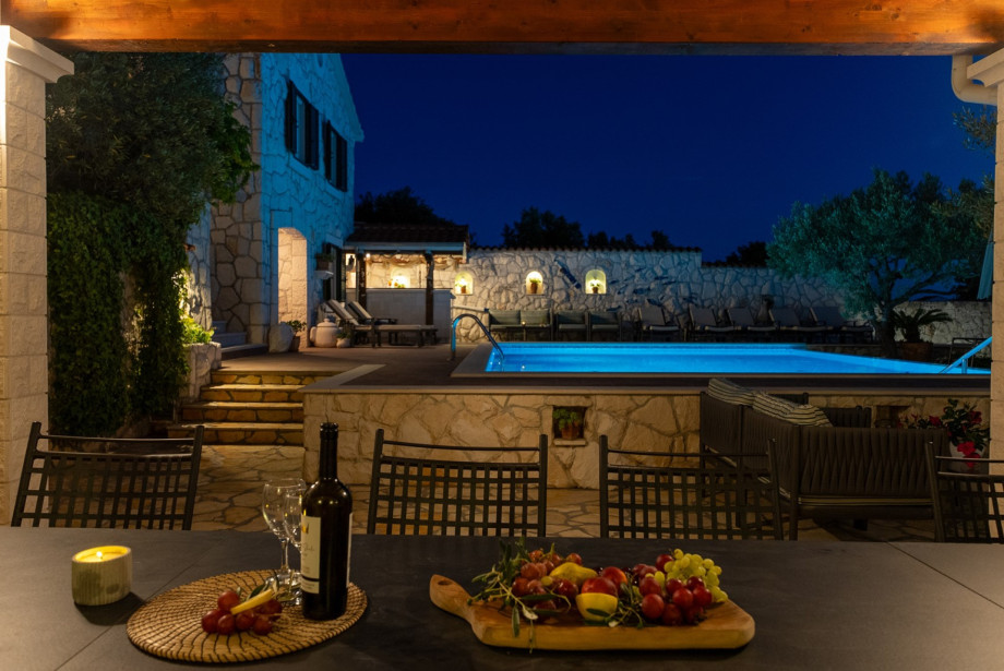 Covered terrace area designed for group dinners right next to the pool level.