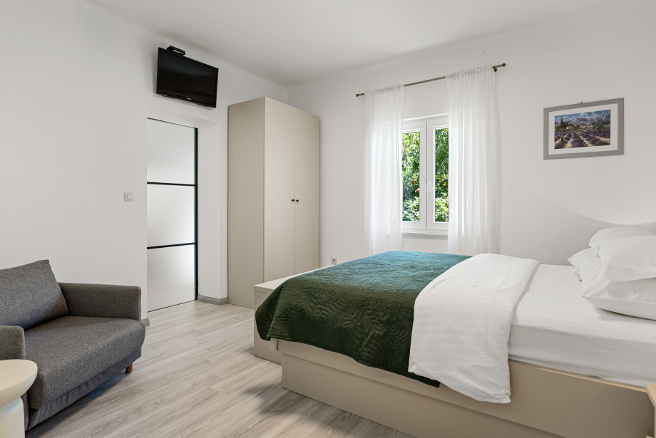First floor that offers: Bedroom NO3 with double bed 160 x 200, sofa bed 80 x 200, TV, A/C, en-suite bathroom with shower