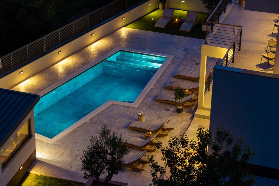 Relax by the 30 sqm private pool featuring hydromassage and a spacious sun deck with 10 loungers.