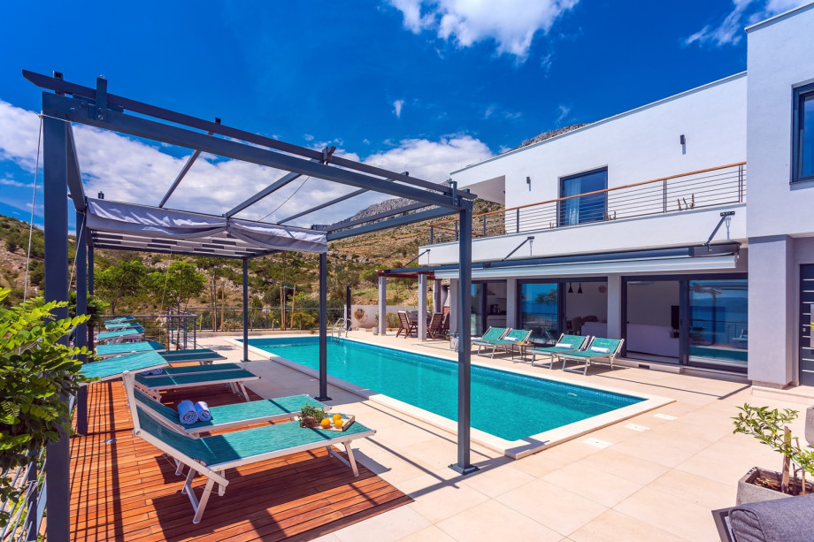 Covered outdoor dining area with barbecue
