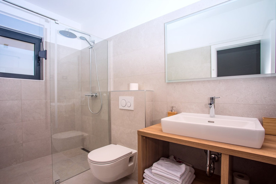 En-suite bathroom with shower and a terrace
