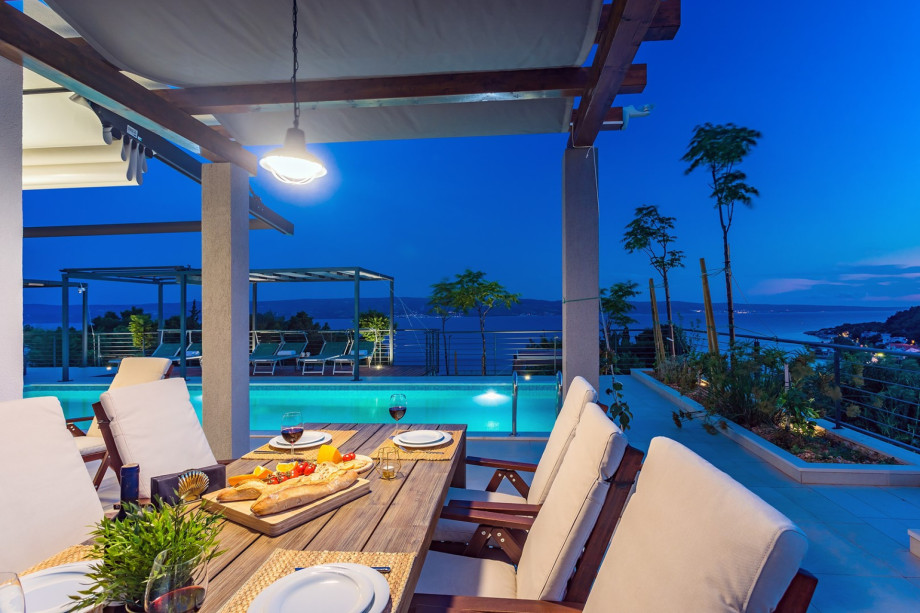 Comfortable dining area with BBQ surrounded with great lights