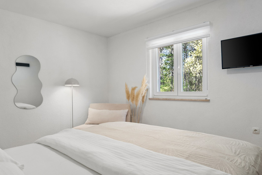 Dieses 23 m2 Schlafzimmer ist klimatisiert und verfügt über ein Sofa für eine Person.