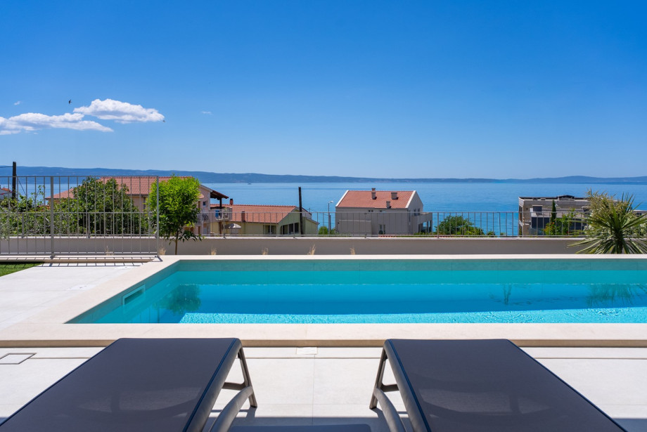 Lower ground floor features a private, heated swimming pool measuring 7m x 3m.