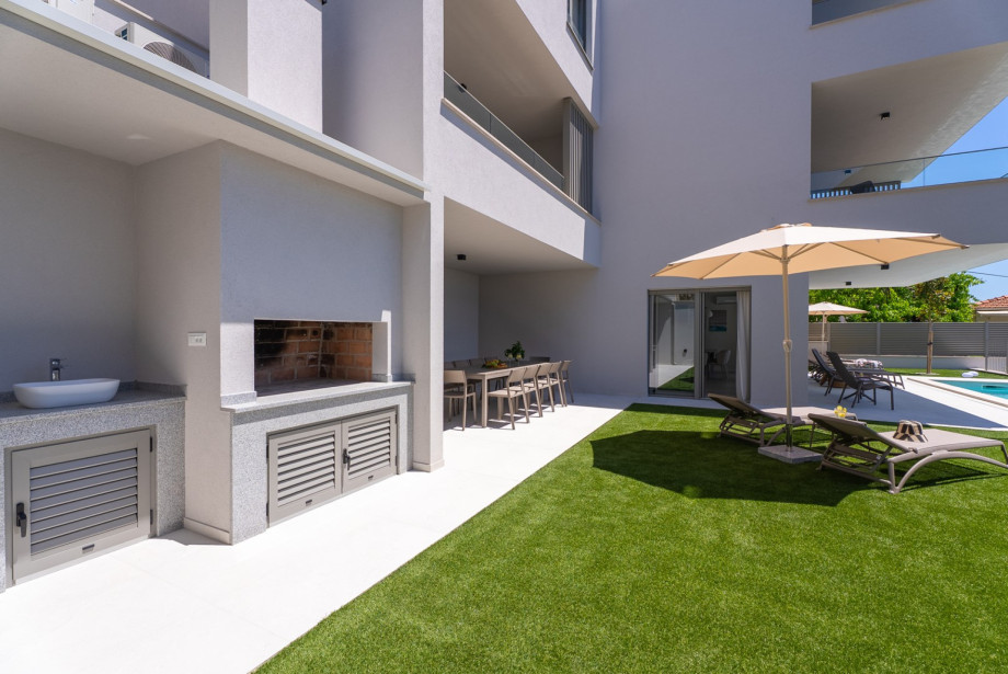 Barbecue area is equipped for preparing traditional wood or charcoal grills.
