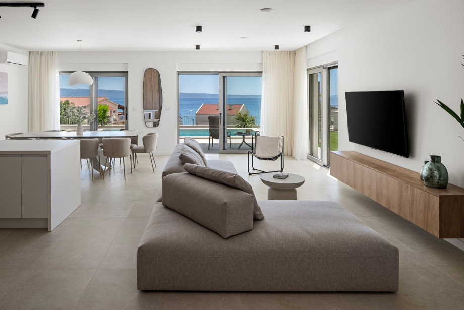 Open-plan living area spans 45 sqm with direct pool terrace access.
