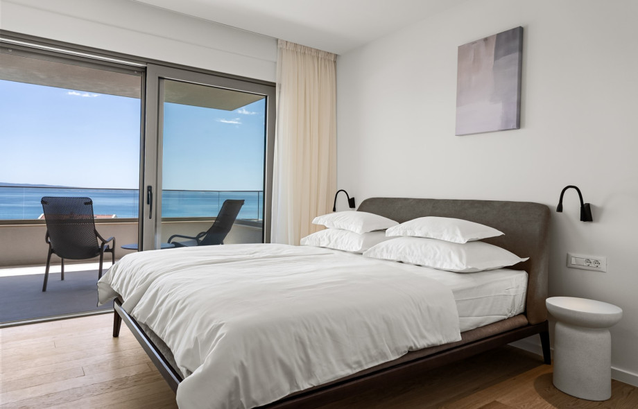 Spacious 17 sqm bedroom No.2 features a king-size bed and air conditioning.