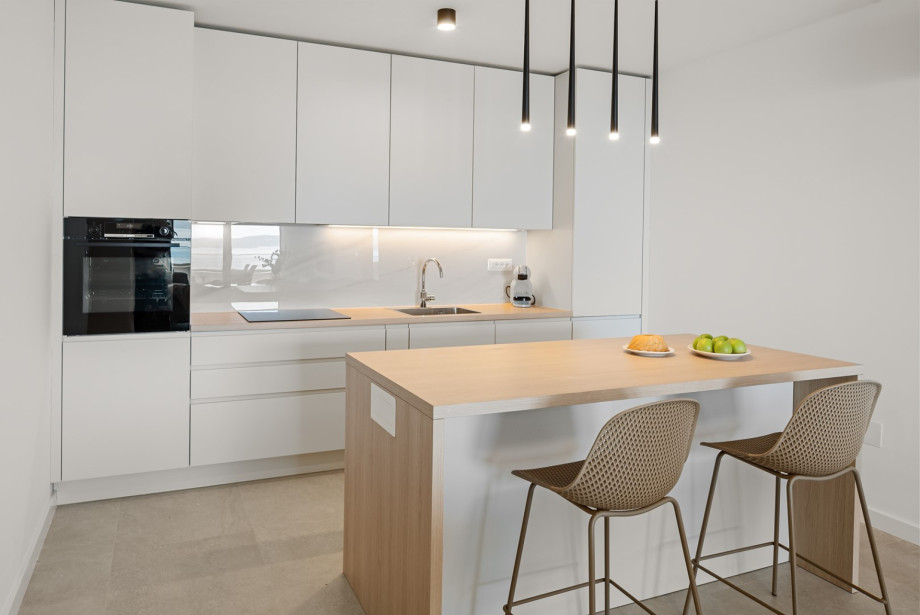 Upper level features an air-conditioned, fully equipped modern kitchen.