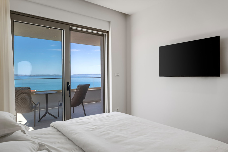 Bright space equipped with a flat-screen TV and simple styling.