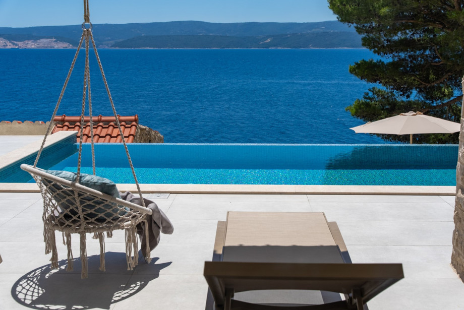 The pool area offers spectacular views of the sea and nearby islands.