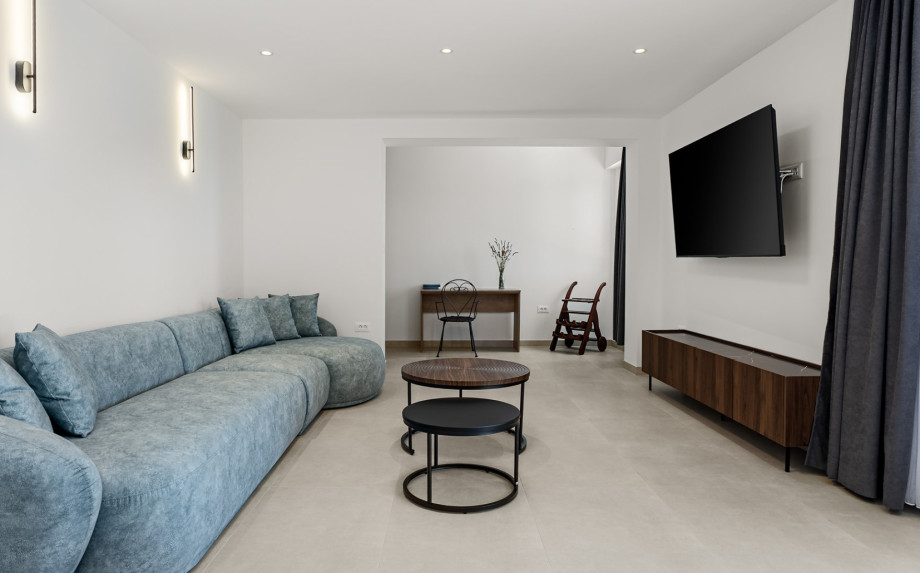 Entertainment setup includes a flat-screen TV and a PlayStation 5 console.