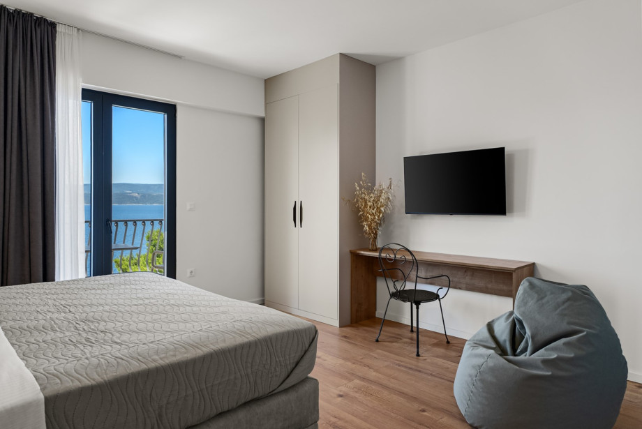 Room is fully air-conditioned and includes a flat-screen TV.