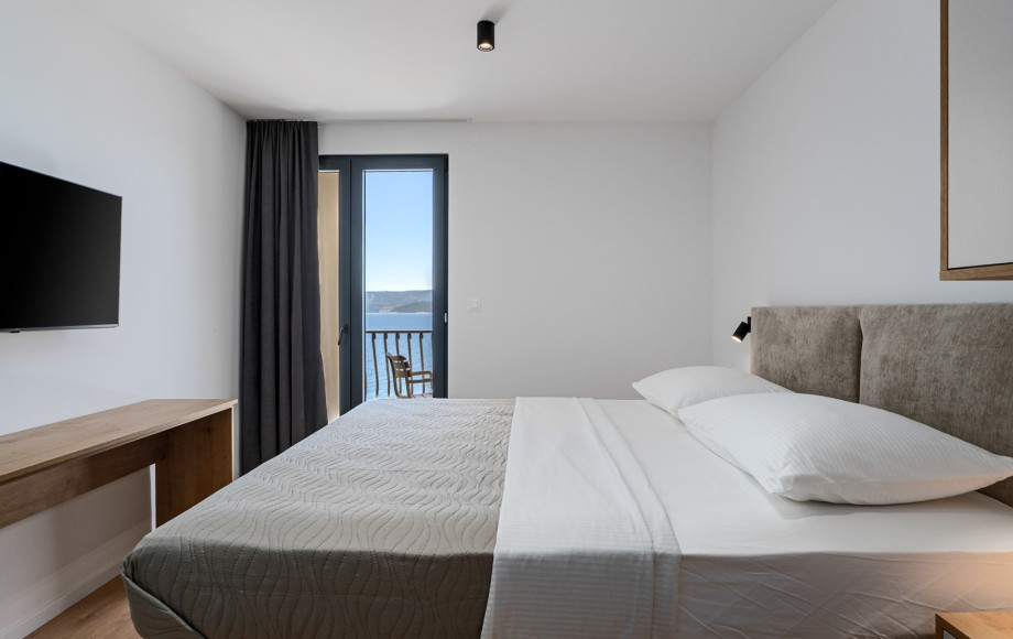 Bedroom No.4 is equipped with a comfortable king-size bed (180 cm x 200 cm) and air conditioning.